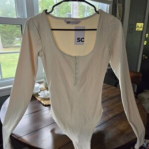 Body suit. New with tags. Small